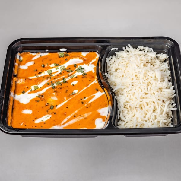 Spicy Chowk's Indian butter chicken with white rice in a black takeout container.